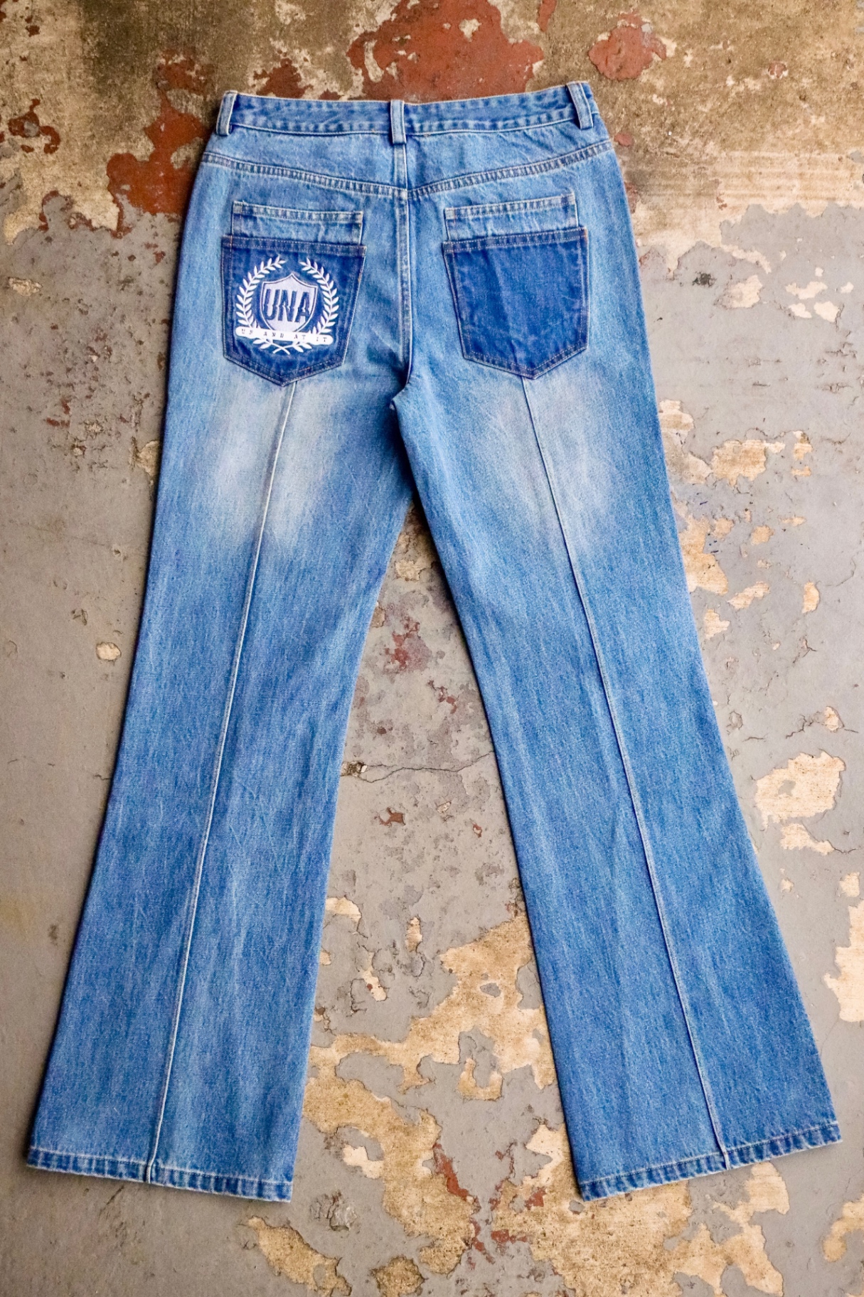 UNA Crest flare jean with embroidered crest pocket