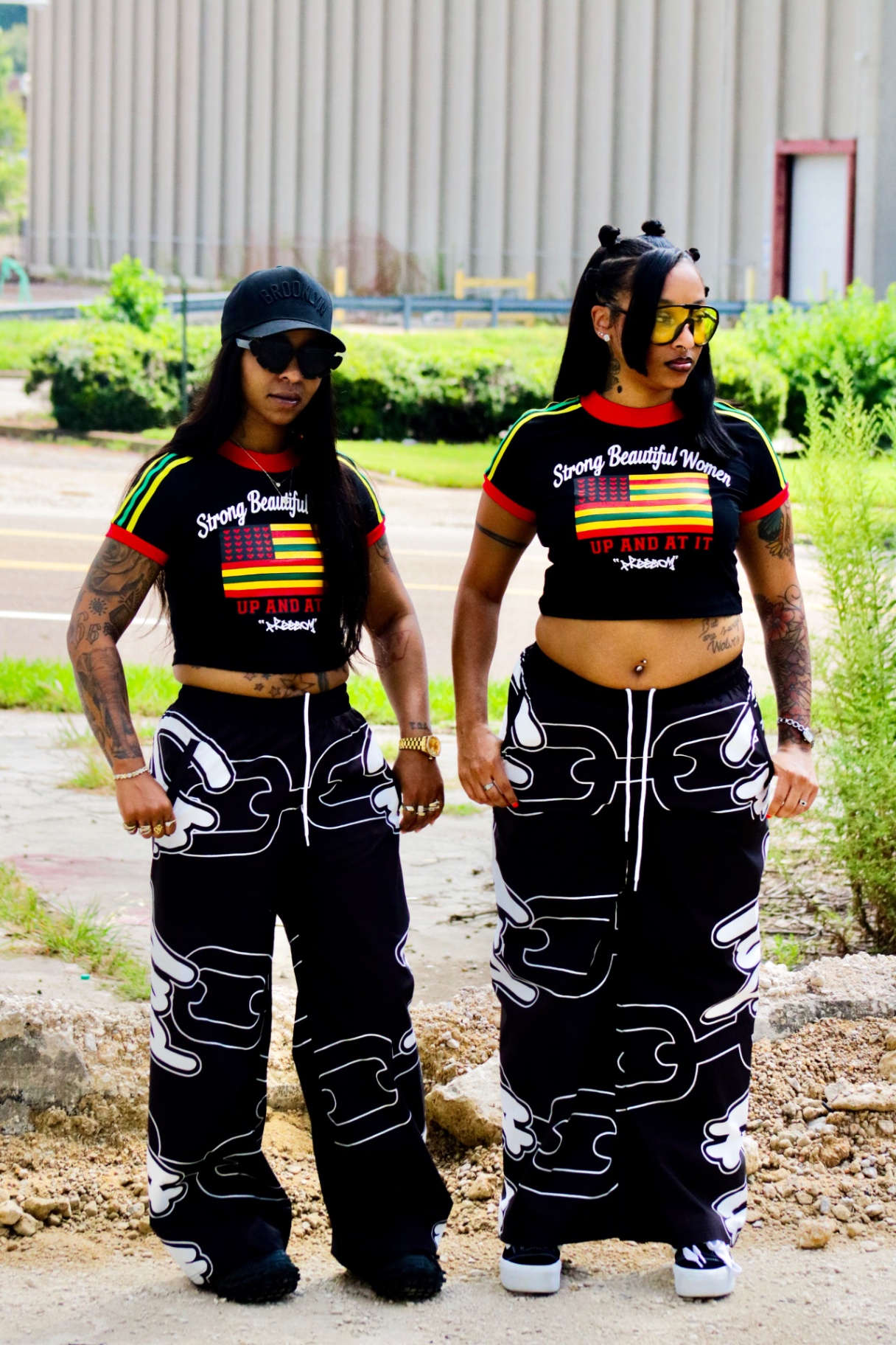Two models in the Freedom crop tee and graffiti wide pants